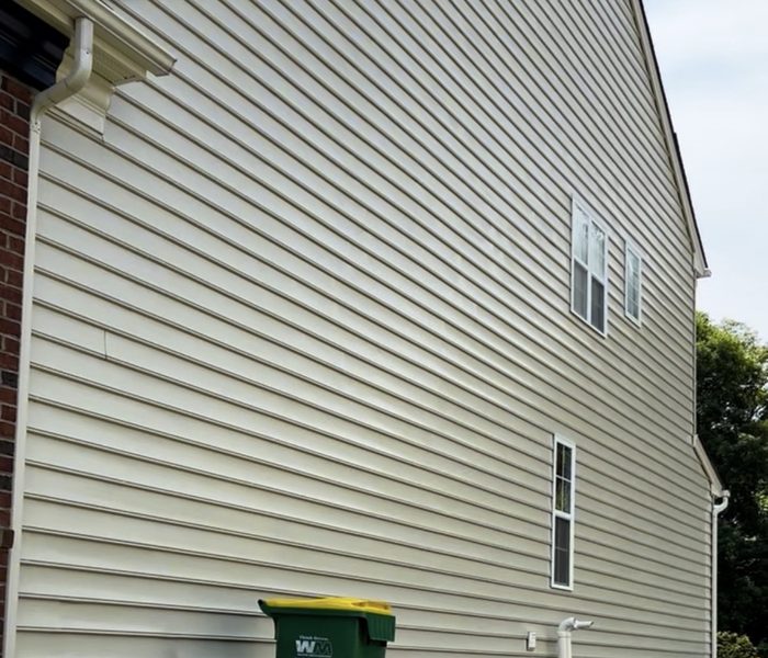 The same vinyl siding clean after a soft wash